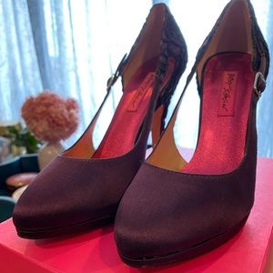 Purple satin Betsey Johnson heels with black lace detail on heel.